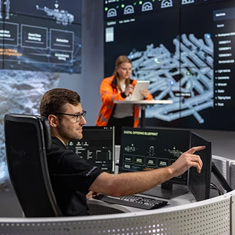 Engineers in the control room of the Sandvik test mine in Tampere (Finland) (photo)