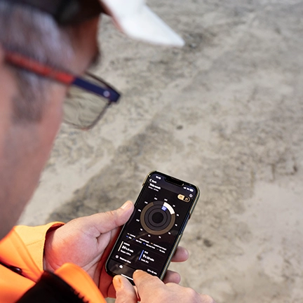 Rock Processing: man in helmet with digital device in his hand (photo)